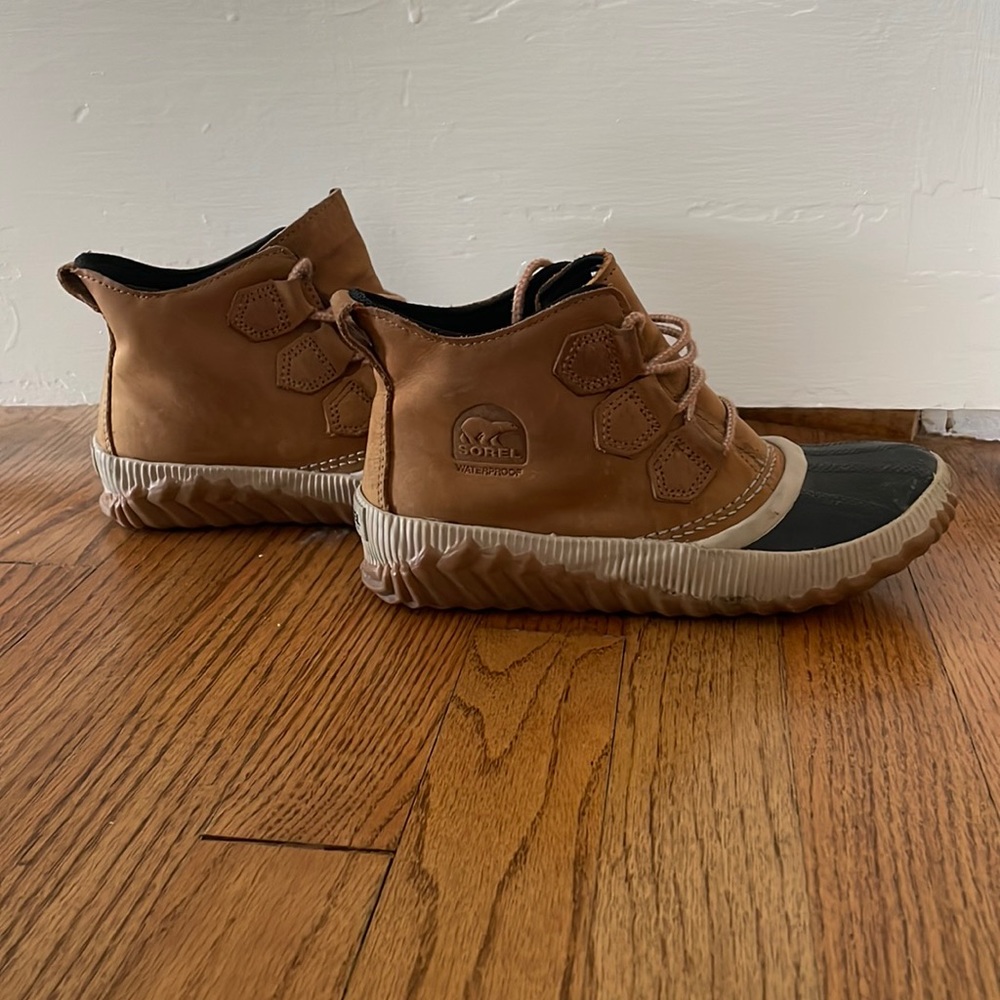 Brown and black sorel boots